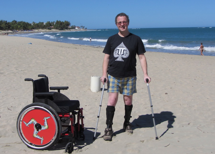 Wheelchair and walking sticks on Cabarete Beach