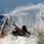 Kitesurfer spraying water