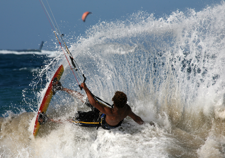 Kitesurfer spraying water