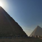 Sun rising over pyramid