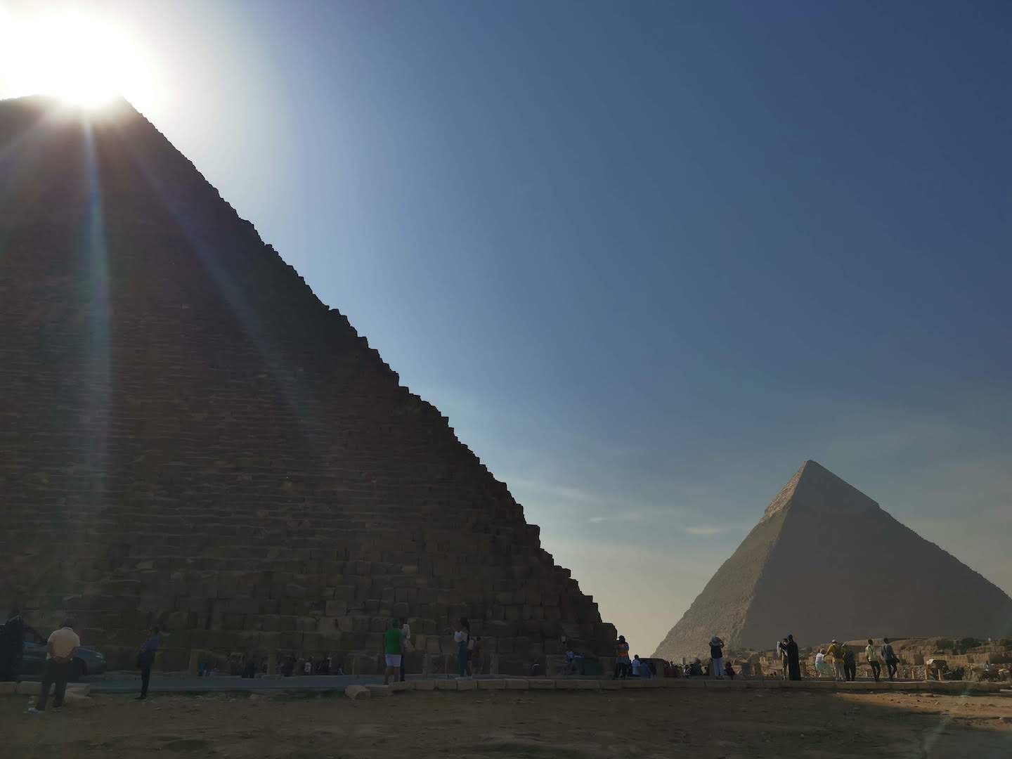 Sun rising over pyramid